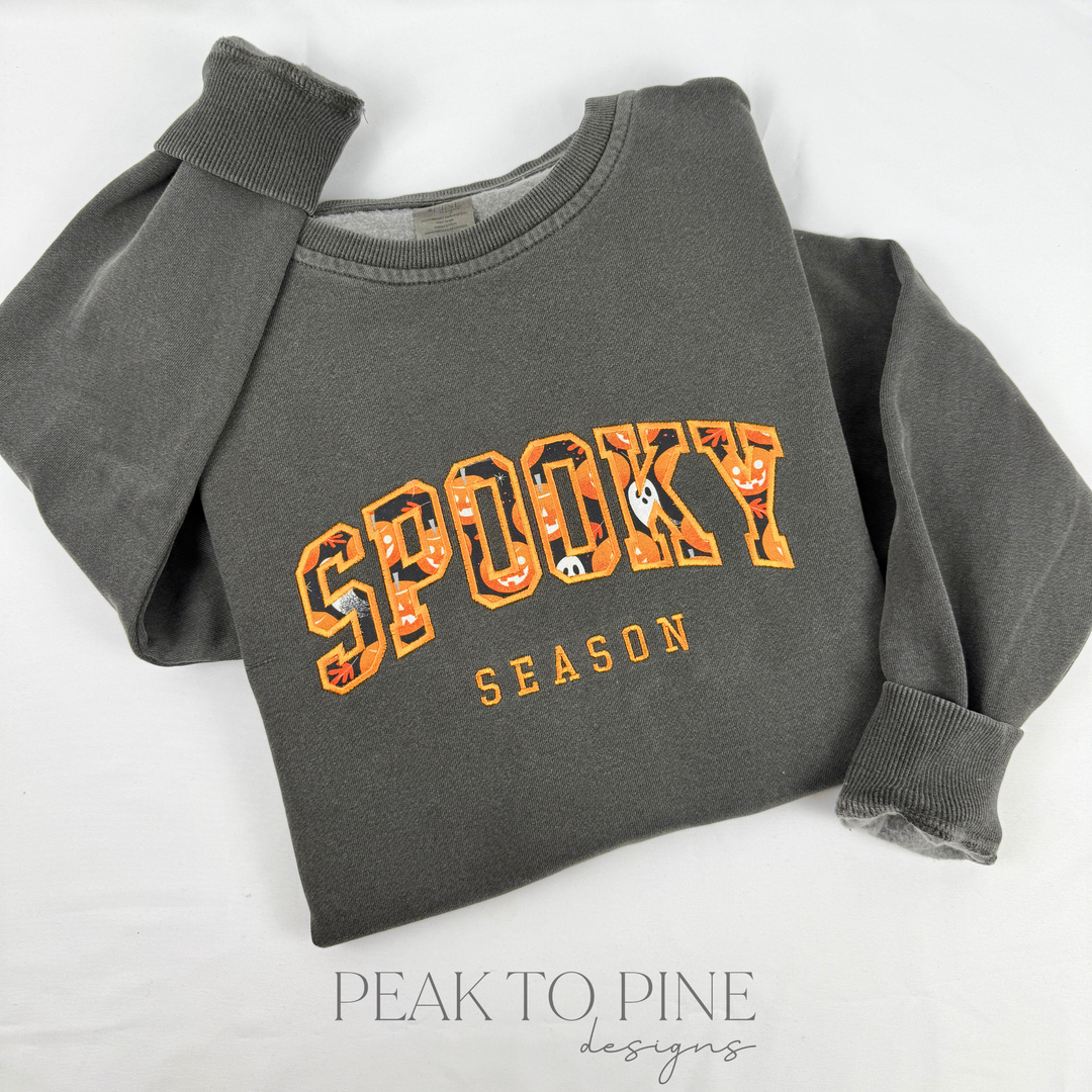 high quality stitched embroidered spooky season marquee letters with pumpkins and ghosts pattern sweatshirt hoodie crewneck